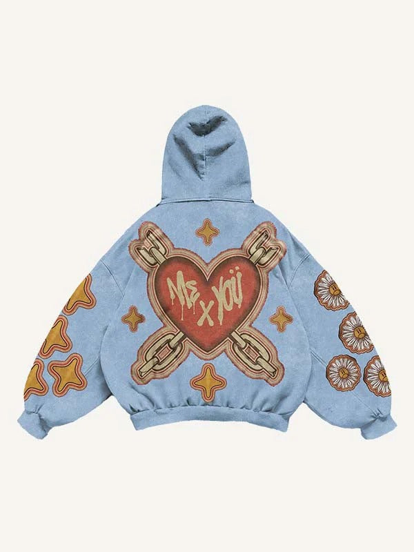 Light blue men’s hoodie with graffiti heart, 'Me x You' text, and bold modern graphic patterns