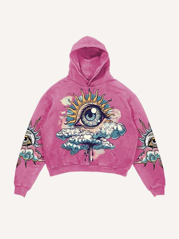 Pink men’s hoodie with eye and sun graphic, cloud details on sleeves, modern streetwear style