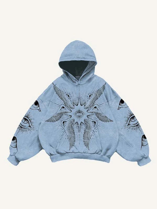 Light blue oversized hoodie with artistic eye and wing graphic, modern men's streetwear by clothbros