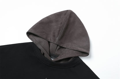 Modern men's black hoodie with grey hood, clean lines, clothbros style, laid on white background